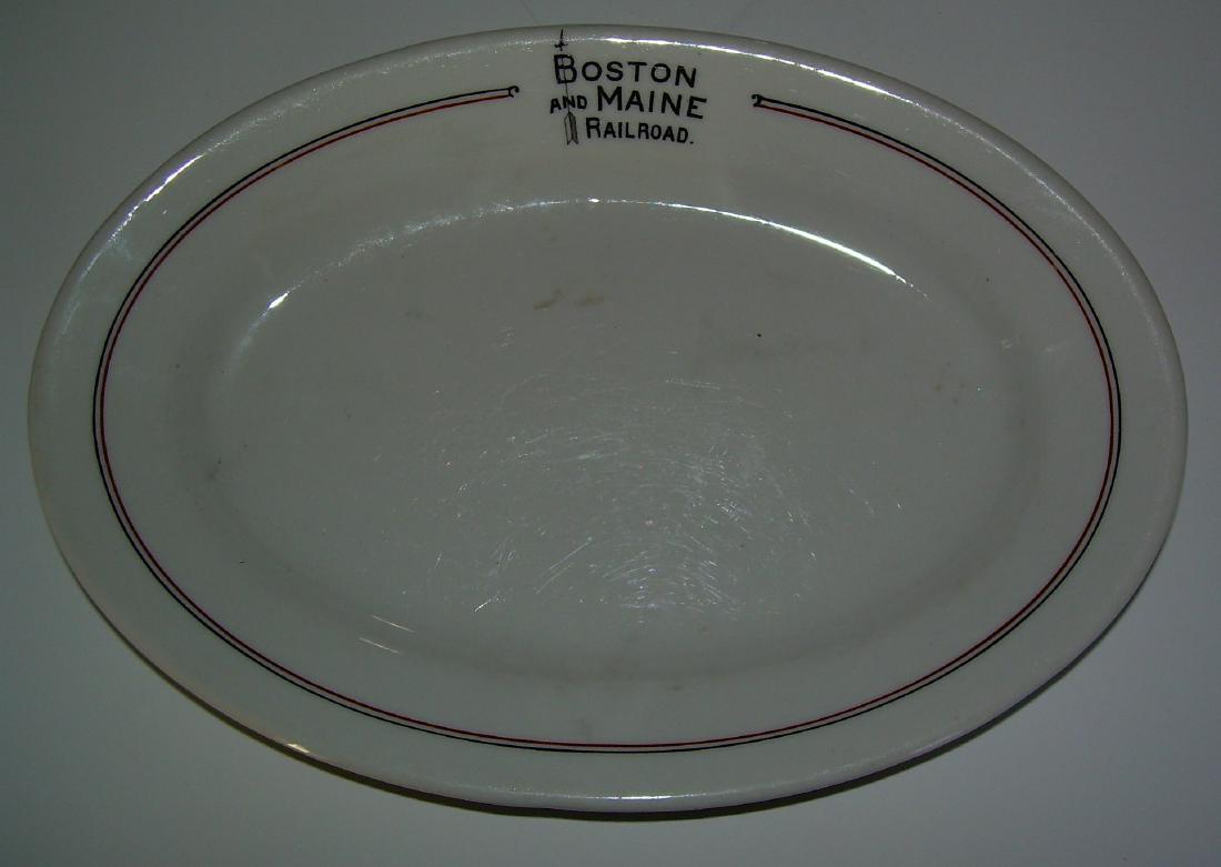 Boston & Maine "Bar Harbor" Platter: An oval china platter made for the Boston & Maine Railroad in the "Bar Harbor" pattern. It measures 9" by 6 1/4". It has a glaze flaw in the food well. There is also some age spotting. Still a nice pi