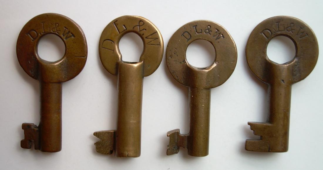 DL&W RR (4) Different Switch Keys: A group of 4 keys from the Delaware Lackawanna & Western Railroad (1) DLW on the front with Fraim dog-bone logo on reverse (2) DL&W on front and T2426 on reverse (3) DLW on front and Fraim keystone lo