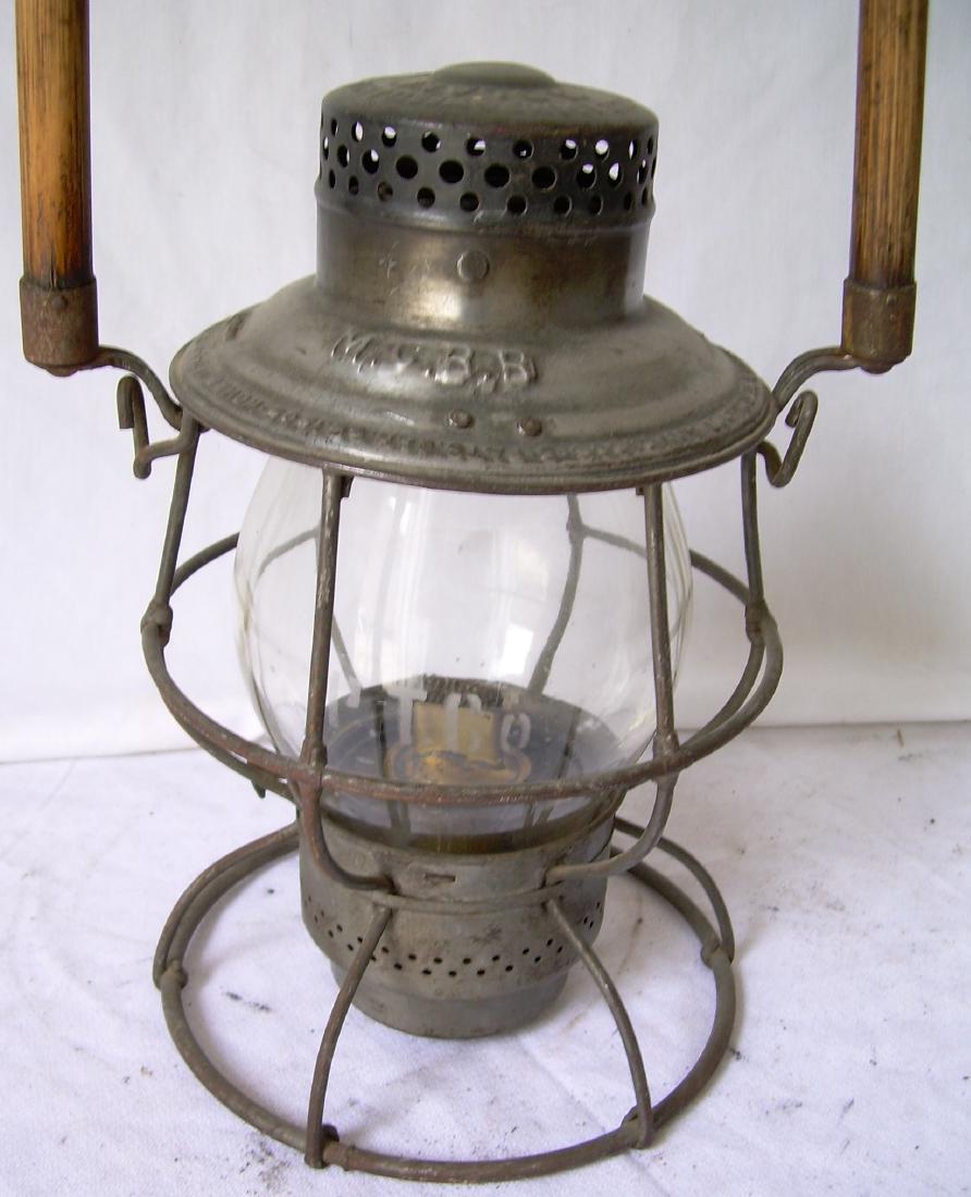 Maine Central Lantern w. Portland Terminal Globe: An Adlake Reliable with a wooden bail (prevents ice from sticking to a glove) and it has MCRR stamped on the lid. Great news is a PTCo etched globe for the Portland Terminal Company. These globes don�