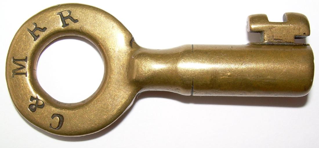 Concord & Montreal Railroad Switch Key: A post Concord and Boston Concord & Montreal merger key that would be used between 1889 and 1895. This is the fat dog-leg model. There are a few other C&M switch bits probably due to the number of pre