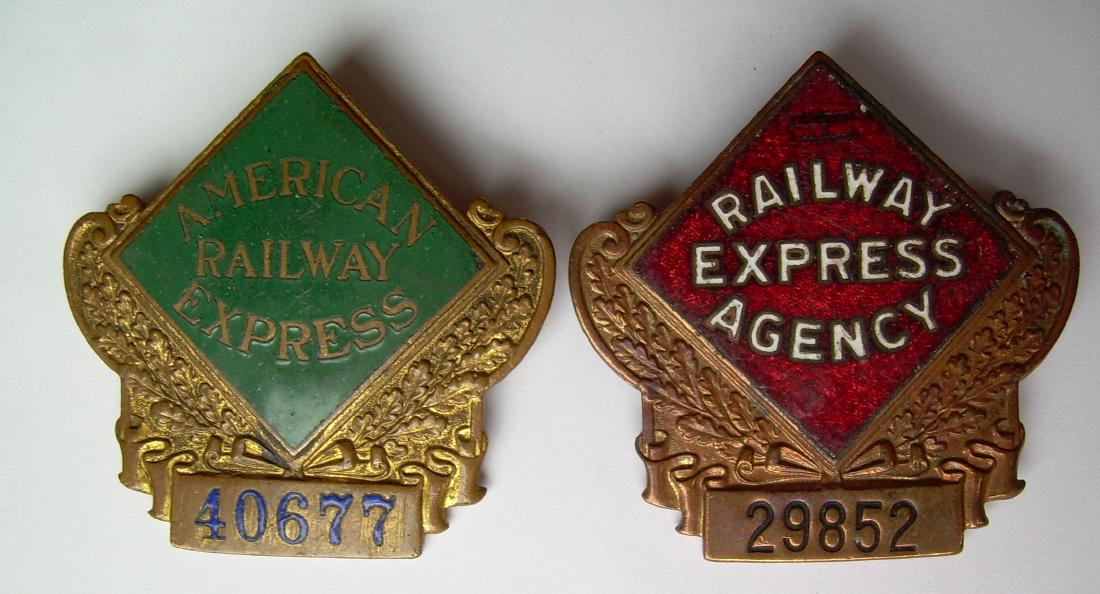 2 Railway Express Badges: American, REA: 2 Express Company pin back badges: (1) American Railway Express - 40677 (2) Railway Express Agency - 29852. Both have Bastian Brothers hallmarks on the reverse. The enamel on both is fine.