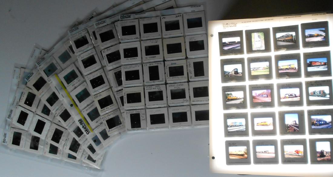 Railroad Locomotive Color Slides (199): A group of original color slides that are in a binder that has protective plastic insert sheets that hold 20 slides per sheet. Expect diverse geography. This group features diesel locomotives from Cla