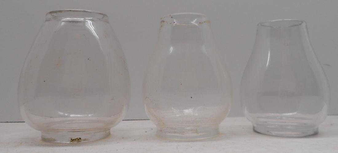 3 Railroad Conductor Lantern Globes all different: A group of 3 railroad lantern globes. They are all free blown (not made in a mold). They all vary in size: (1) 4 3/4 visible, 2 1/2" top diameter, 2 5/8" base diameter (2) 4 1/2" visible, 2 1/8" top d