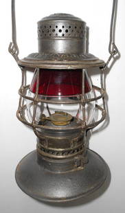 Red / Clear #39 Globe in Penna Lines BB Lantern Frame: An interesting red over clear #39 size globe in an Adams & Westlake bellbottom frame. The frame has a twist-off bell. The lid has PENNSYLVNAIA LINES stamped in standard A&W lettering. The bell has a t