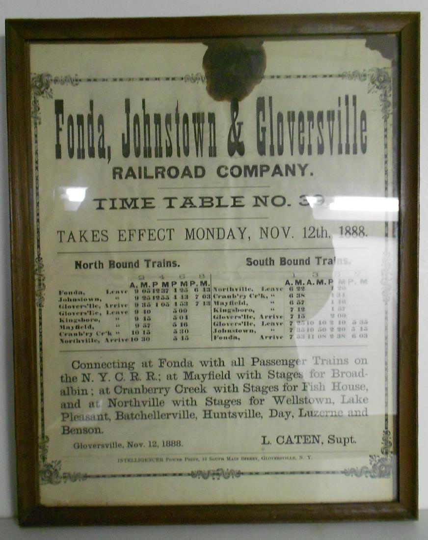 Fonda Johnstown & Gloversville 1888 Timetable: A framed timetable from the FJ&G dated 11/12/1888. It is timetable #39 and it measures 11" by 14". It took an hour and a half to go from Fonda to Northville. Some staining up top.