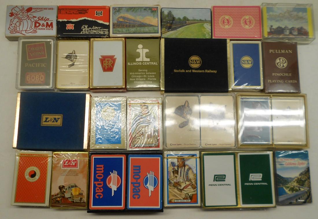 29 Decks of Railroad Playing Cards: A large group of railroad playing cards. Some are double decks, some singles. Many are sealed in original cellophane. Several different railroads are represented.