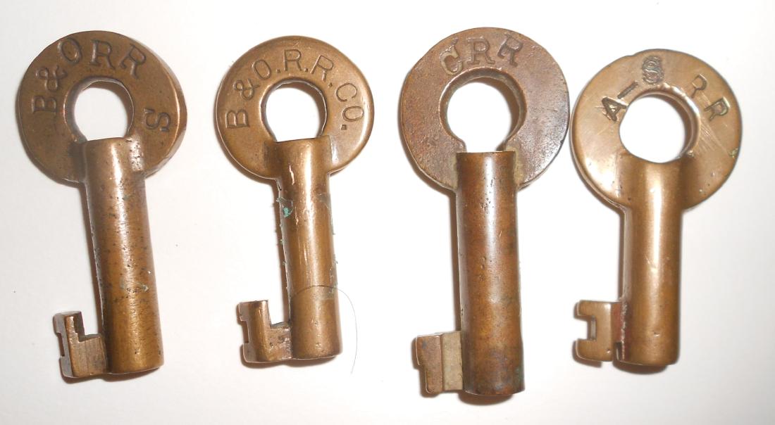 4 Switch Keys: B&O, CRR, A-S: 4 brass switch keys: (1) B&O RR S / 148237 (2) B&ORRCO / 117825 Slaymaker "S" (3) CRR - consignor thinks it's Clinch / 993 Slaymaker (4) A-S RR / 103 Fraim dog-bone hallmark - Aliquippa & Southern ?