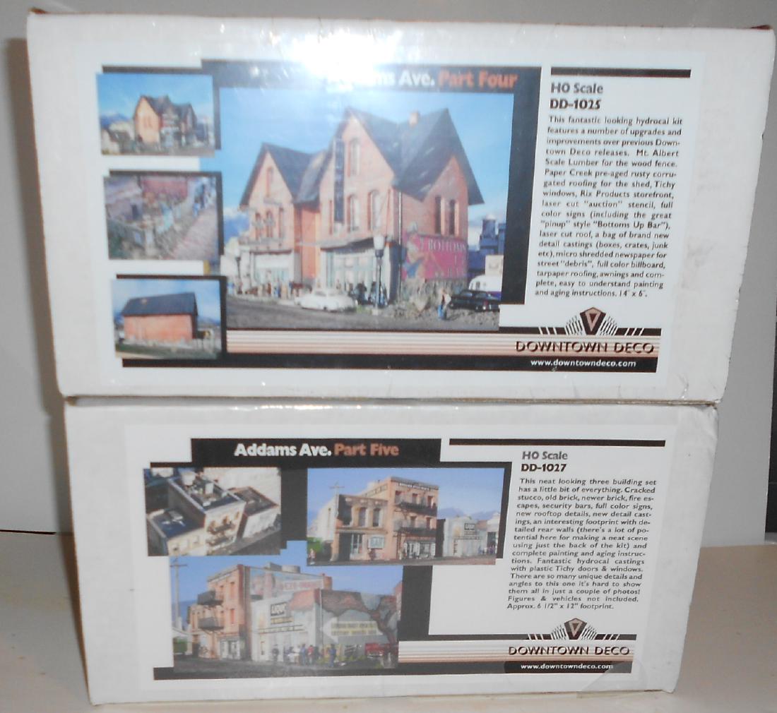 2 Downtown Deco HO Hydrocal Kits Addams 4,5: A pair of HO hydrocal casting kits from Downtown Deco. Both have original shrink wrap and have never been opened. Randy P. did a nice job on these kits. (1) DD-1025 Addams Avenue Part 4 (2) DD-1027 Ad