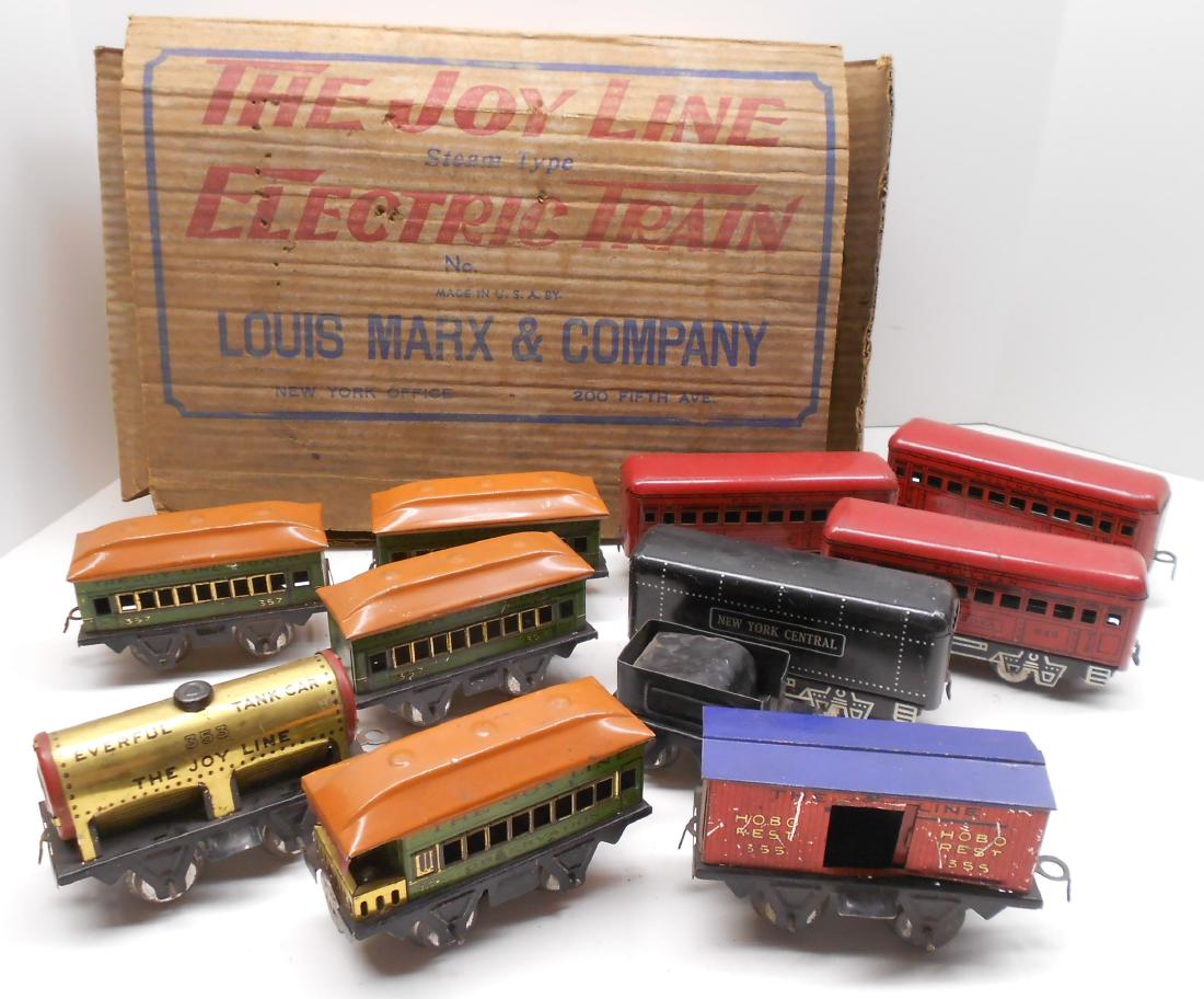 Marx "Joy Line" Lithographed Cars & Box: A very old Marx "Joy Line" box with 11 Marx cars (Joy Line and others) and several others included. The box shows real wear but it's the read deal. The cars include a Joy Line observation car with lig