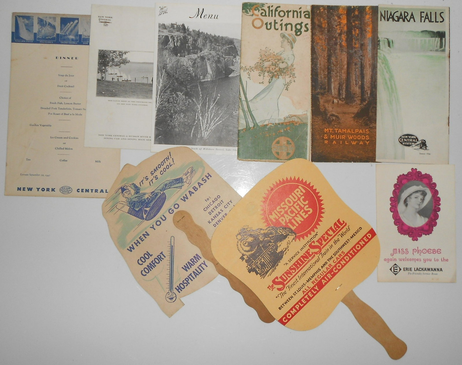 Railroad Menus, Fans, Advertising: Railroad advertising items and menus. 2 NYC menus, 1 D&H menu, two old fans, travel booklets and more advertising.
