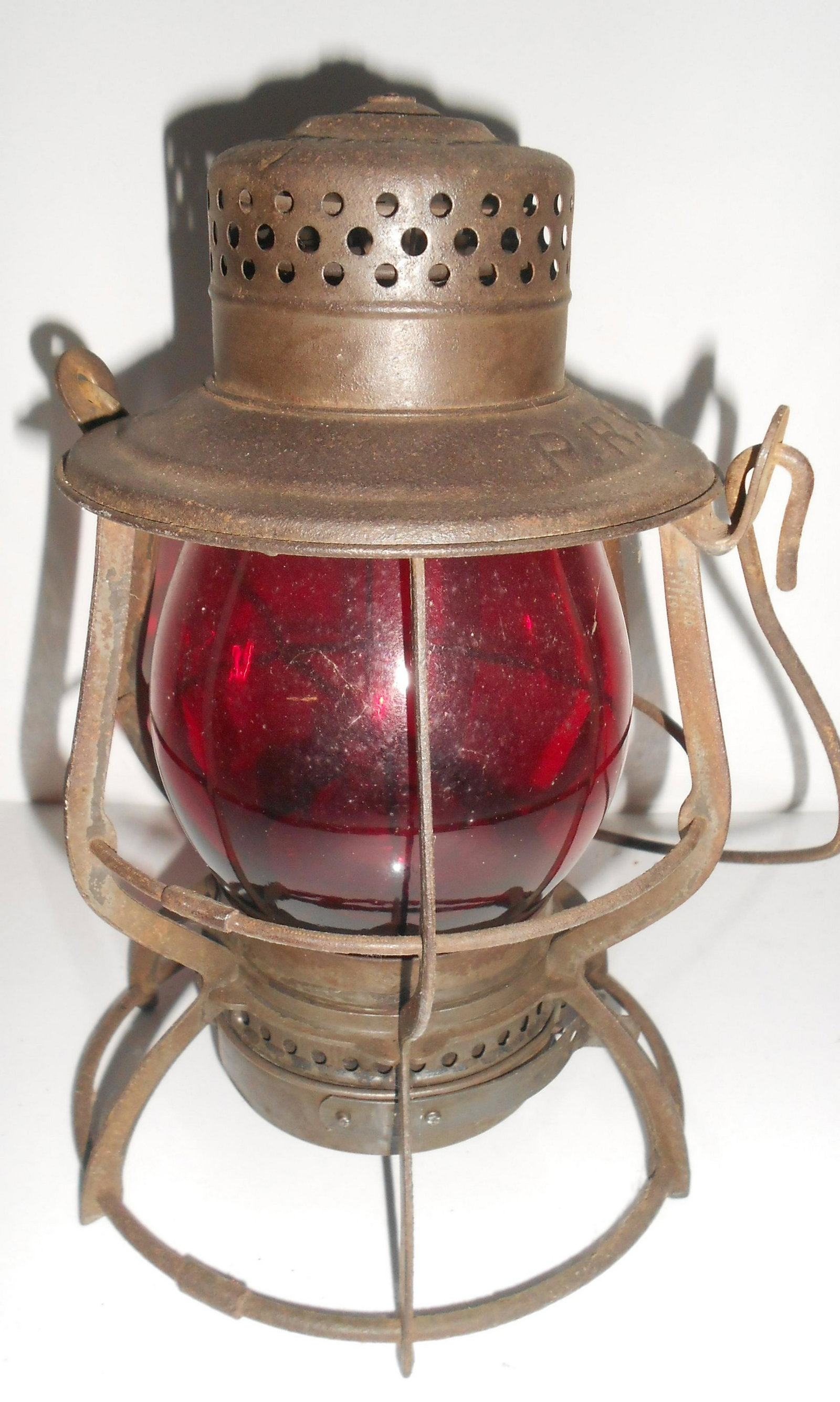 Pennsylvania Railroad Keystone Lantern: Pennsylvania Railroad Keystone "Casey" model lantern that is stamped PRR on the lid. This model has the unique wick adjuster when you spin the bottom like a dial. It has a red cast P/S (Pennsylvania S
