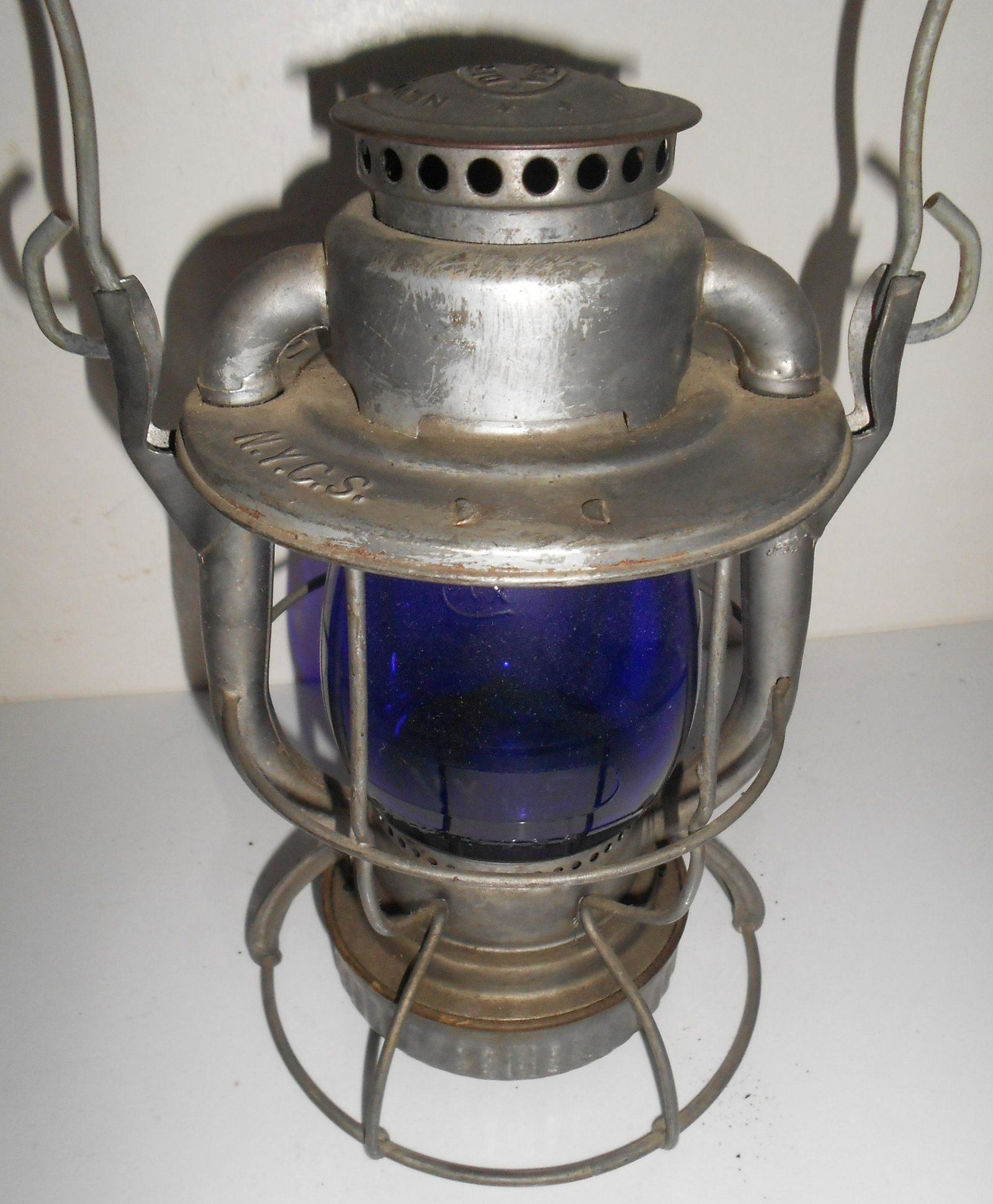 NYCS Dietz Vesta Lantern Blue Etched Globe: Dietz Vesta model lantern stamped NYCS on the lid with a build code of S-3-49. The frame is standard and clean with no issues. The globe is a later style with small base flange and large top flange. I