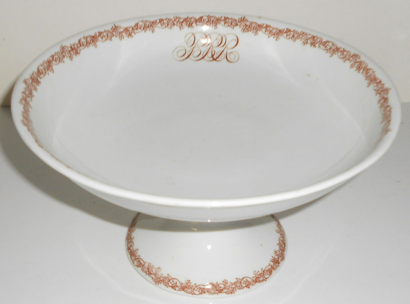 Pennsylvania Railroad "Congressional" Compote: China compote made by Greenwood Pottery for the Pennsylvanian Railroad in their "Congressional" pattern. It measures 9" in diameter and it stands 5" tall. This is big and this is also an early pattern