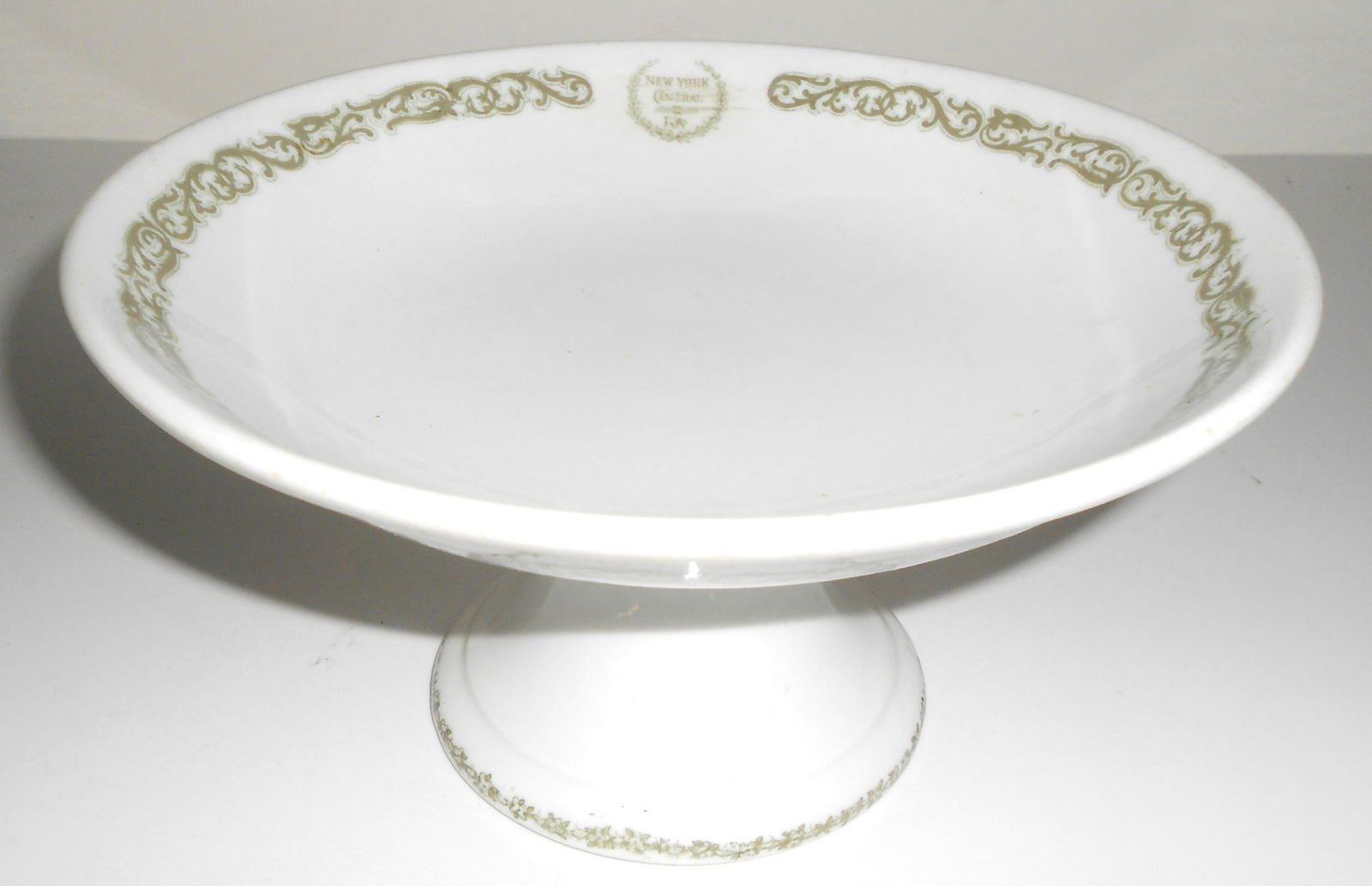 NYC&HR RR "Harmon" pattern Compote: China compote made for the New York Central & Hudson River Railroad in their "Harmon" pattern. It measures 8 3/4" in diameter and it stands 4 1/2" tall. It does not have an OPCo decal on the bottom, h