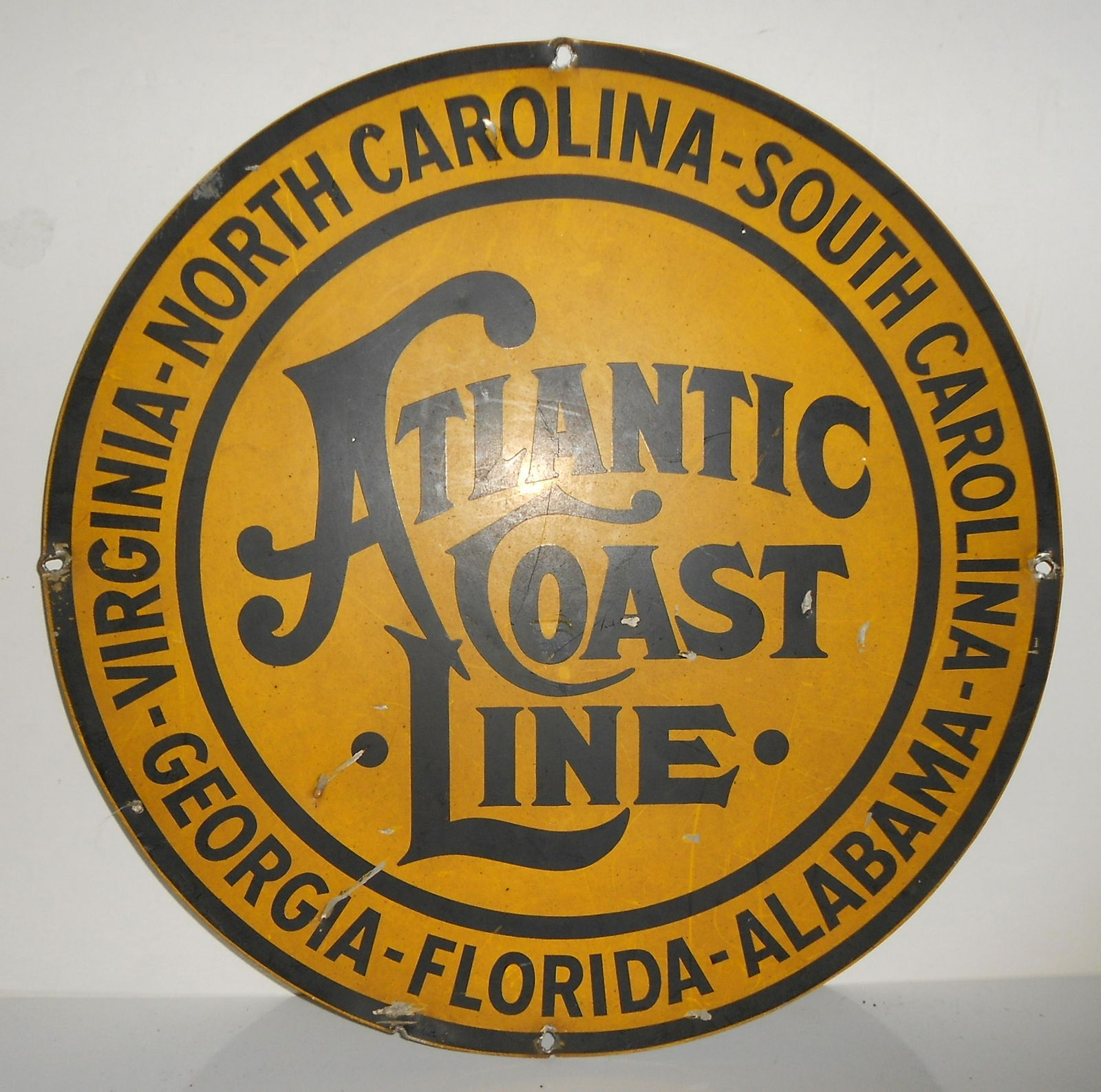 Atlantic Coast Line 22" Metal Sign: Atlantic Coast Line steel sign that measures 22" in diameter. 4 mounting holes. Wear around the holes, a few dings. Nice example with all states served. Single sided.