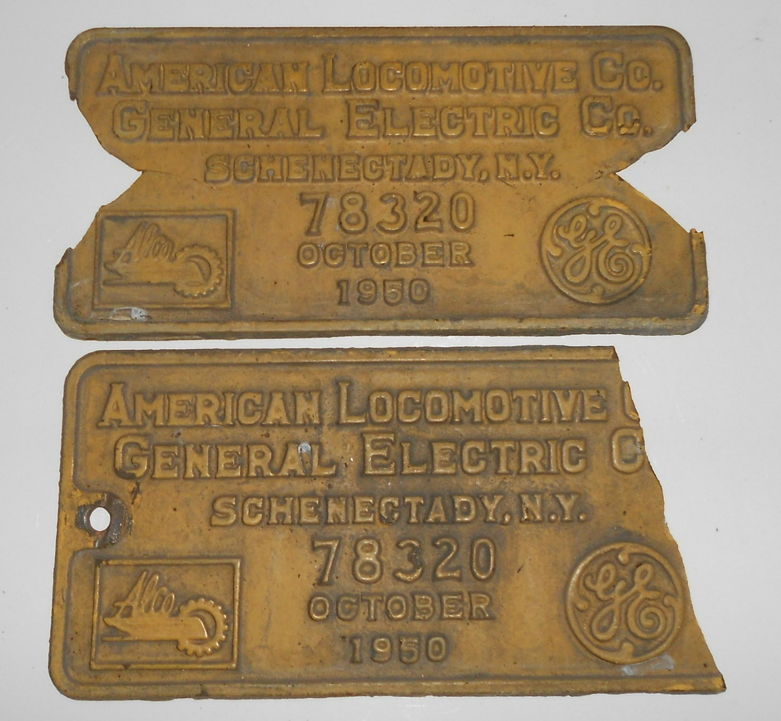 Alco Builder's Plate Erie RS-3 PAIR damaged: An Alco diesel locomotive builder's plate from Erie Railroad RS-3 #1017 built November 1950. Thick cast iron with damage to both plates. Chunks missing but you get the pair. They should measure 12" by