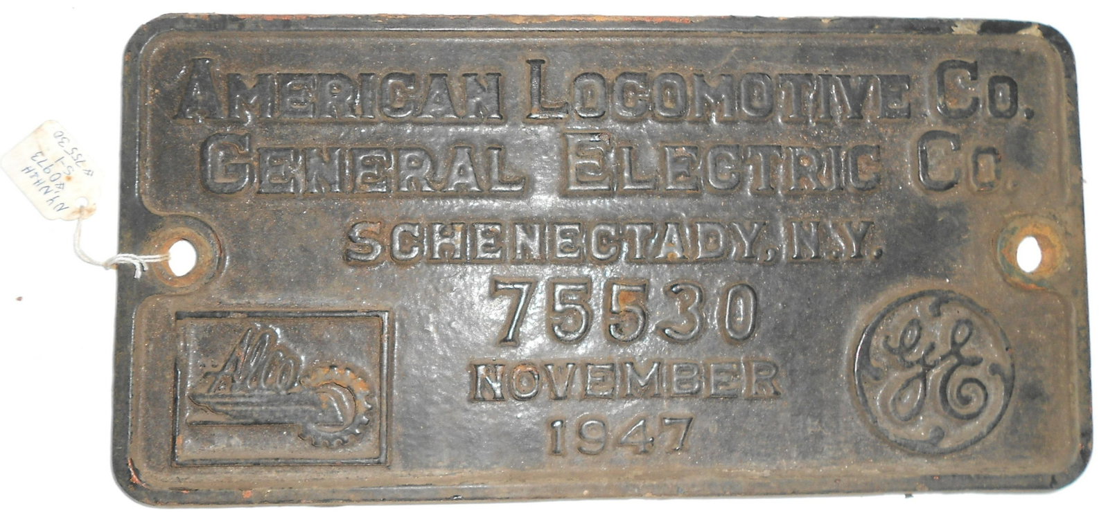 Alco Builder's Plate NH S-1 Serial #75530: An Alco diesel locomotive builder's plate from New Haven Railroad S-1 switcher #0973. This is American Locomotive Company serial number 75530. Thick cast iron with a date of November 1947. Measures 12