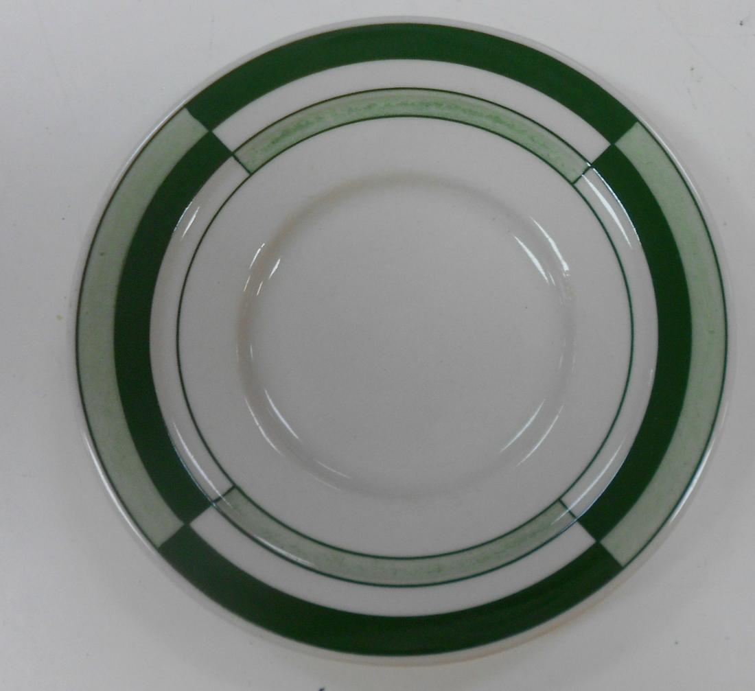 Milwaukee Road "Dulaney" China Plate: A small 5 1/2" bread plate in the Dulaney pattern with full Chicago Milwaukee St Paul & Pacific initials and "Hiawatha" and pattern name on the reverse. Very clean. Hard to find because of limited ori