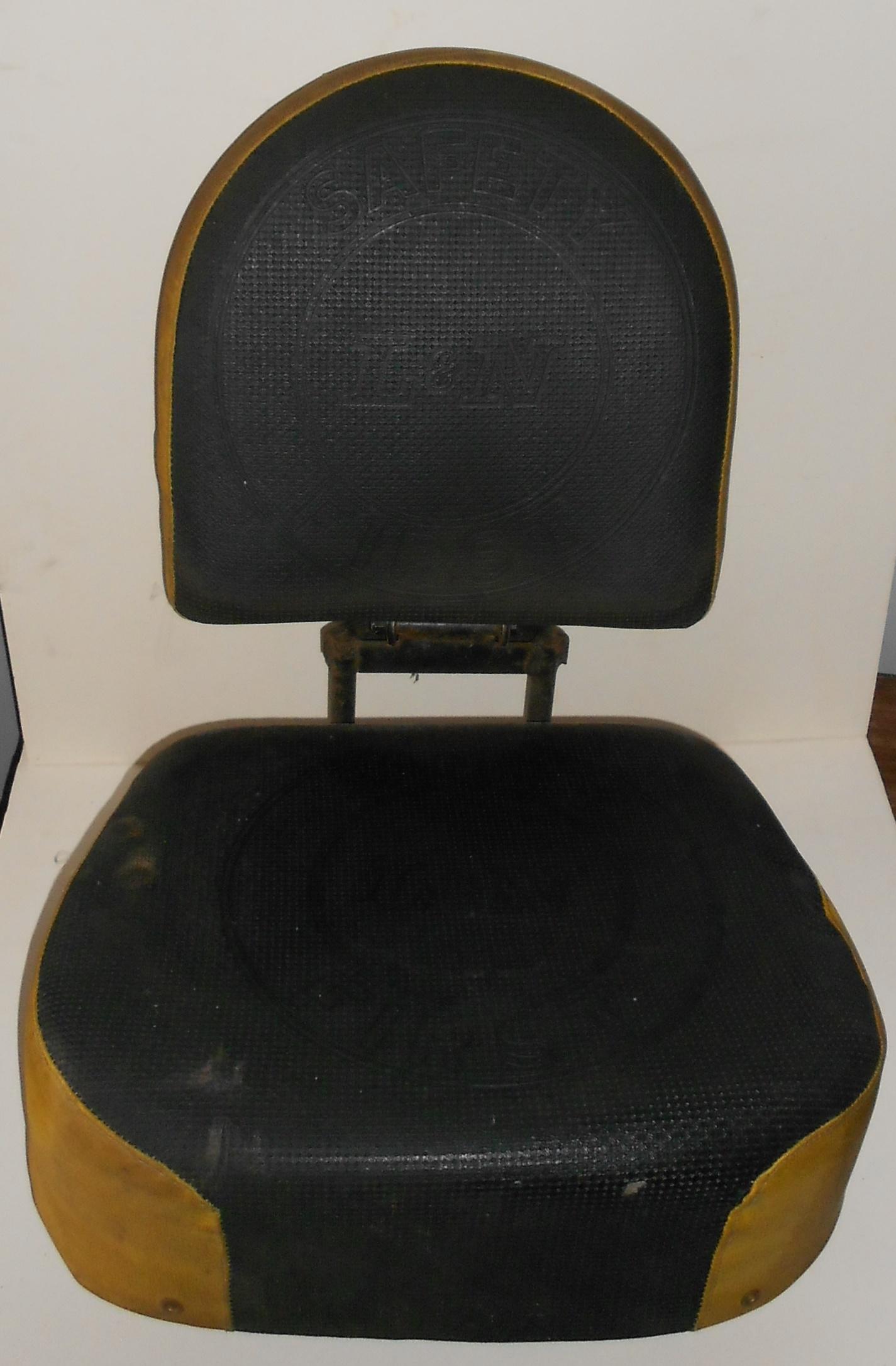 Louisville & Nashville Diesel Locomotive Seat: Our consignor liberated this seat from a Louisville & Nashville diesel waiting on a scrap line a long time ago. The seat has yellow trim on the base. The seat without base measures 26" tall when unfol