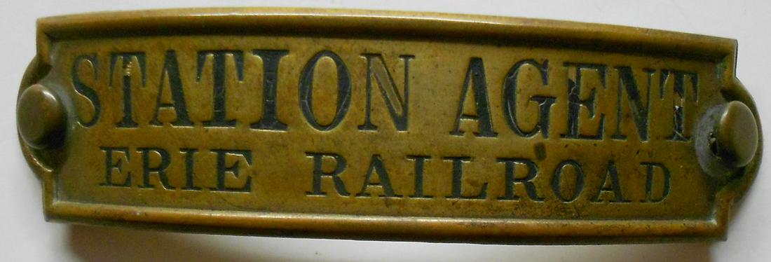 Erie Railroad "Station Agent" Badge - E. J. Brooks: An older Erie Railroad badge made by E. J. Brooks in New York. The occupation is Station Agent. The Brooks hallmark is faint but you can make out most of it on the reverse.