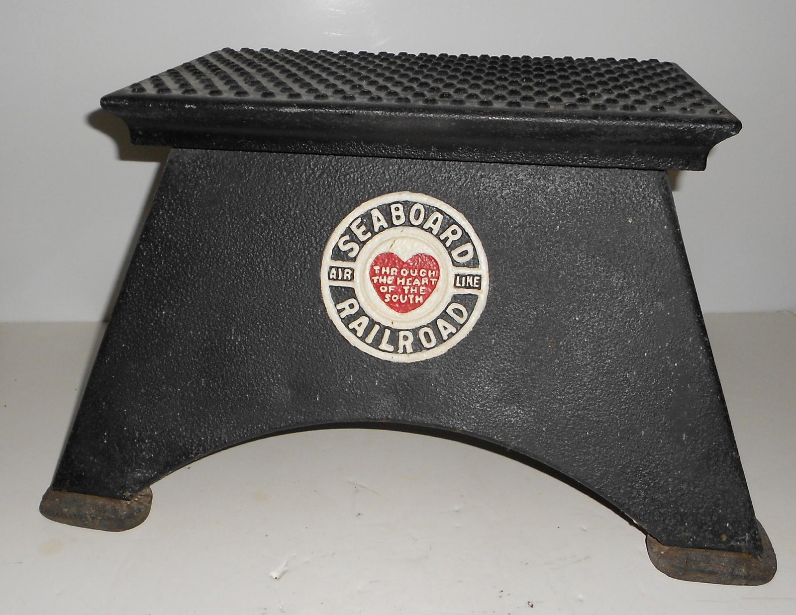 Seaboard Railroad Embossed Morton Step Box: A restored Seaboard Air Line passenger step box with the Seaboard round logo. This is what is commonly called a 1/2 step and the top measures14" by 9 1/2". This box has original older rubber feet that