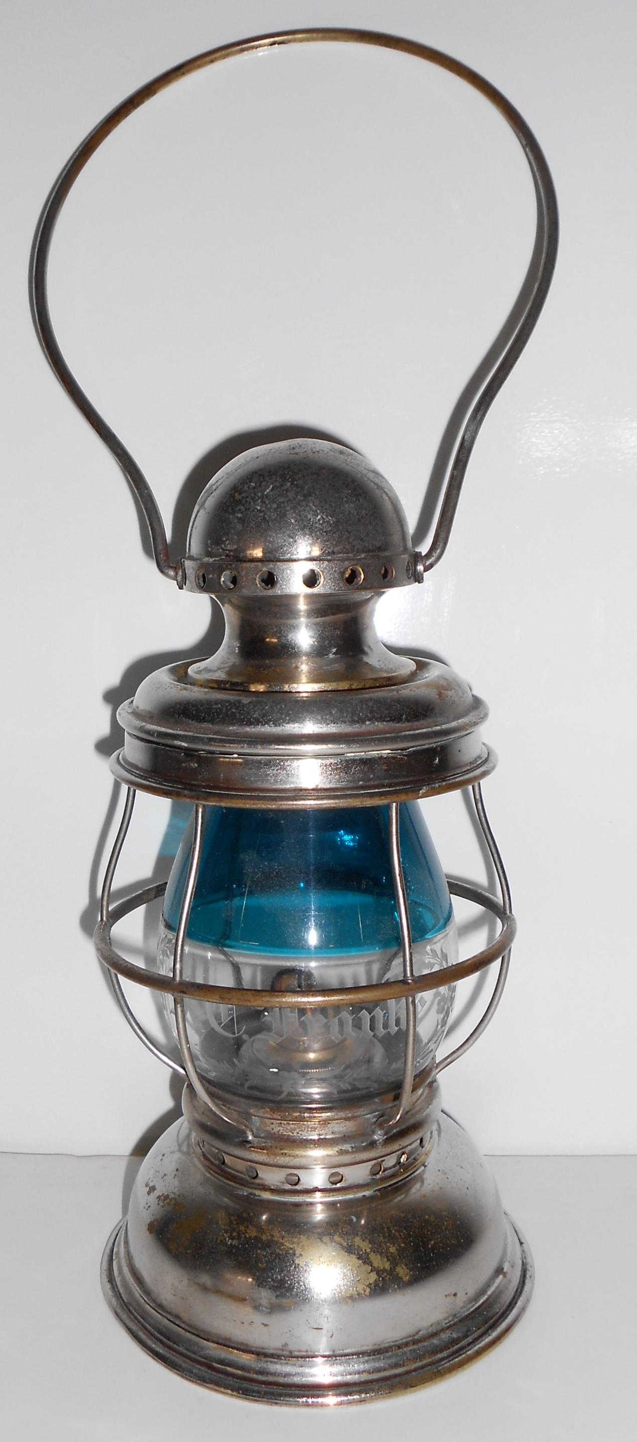F. C. Franlie Presentation Lantern - Post & Co. Cin.: A Post & Company brass plated lantern from Cincinnati Ohio. This is a standard "dome" top conductor style lantern with the odd Post threaded top rather than a thumb latch. It has a Post hallmark on th