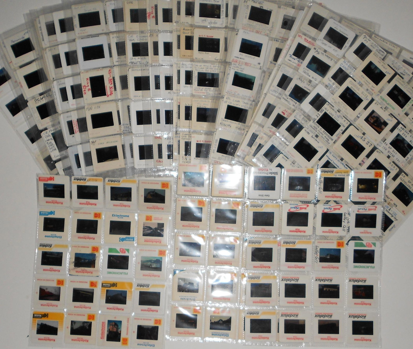 600 Mixed topic Color slides: About 600 slides of mainline, shortline, electric lines, trolleys bus and transit subjects. All have protective sleeves and my photos lack clarity because they are on the light table in sleeves and my