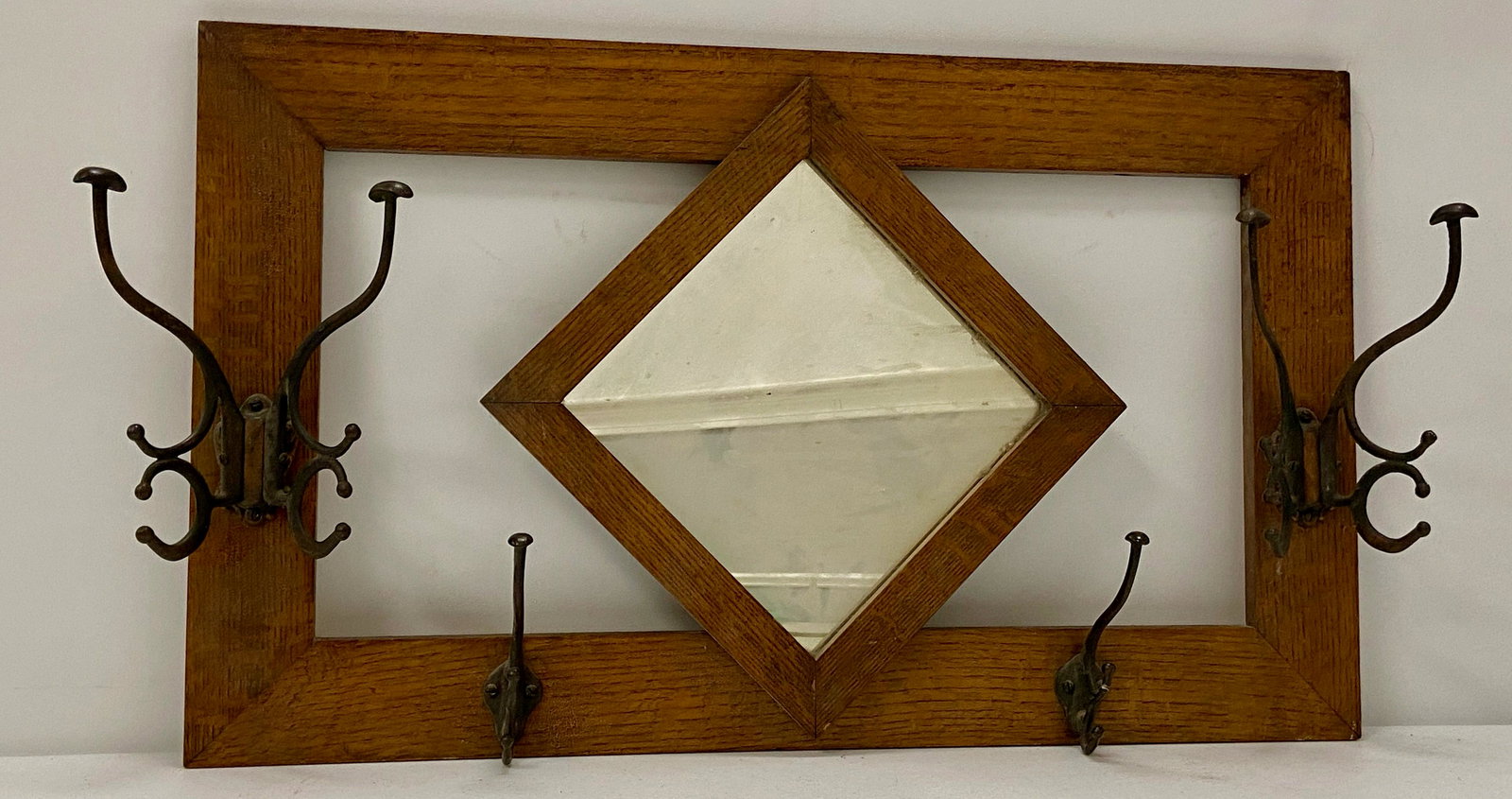 Oak coat Rack & Hooks: Oak coat rack, 2 double hooks, 2 single hooks, w/mirror in center, 18.75" x 31.25", & wooden bracket w/6 hooks, 2 metal mounting brackets, on end, 31.5" long