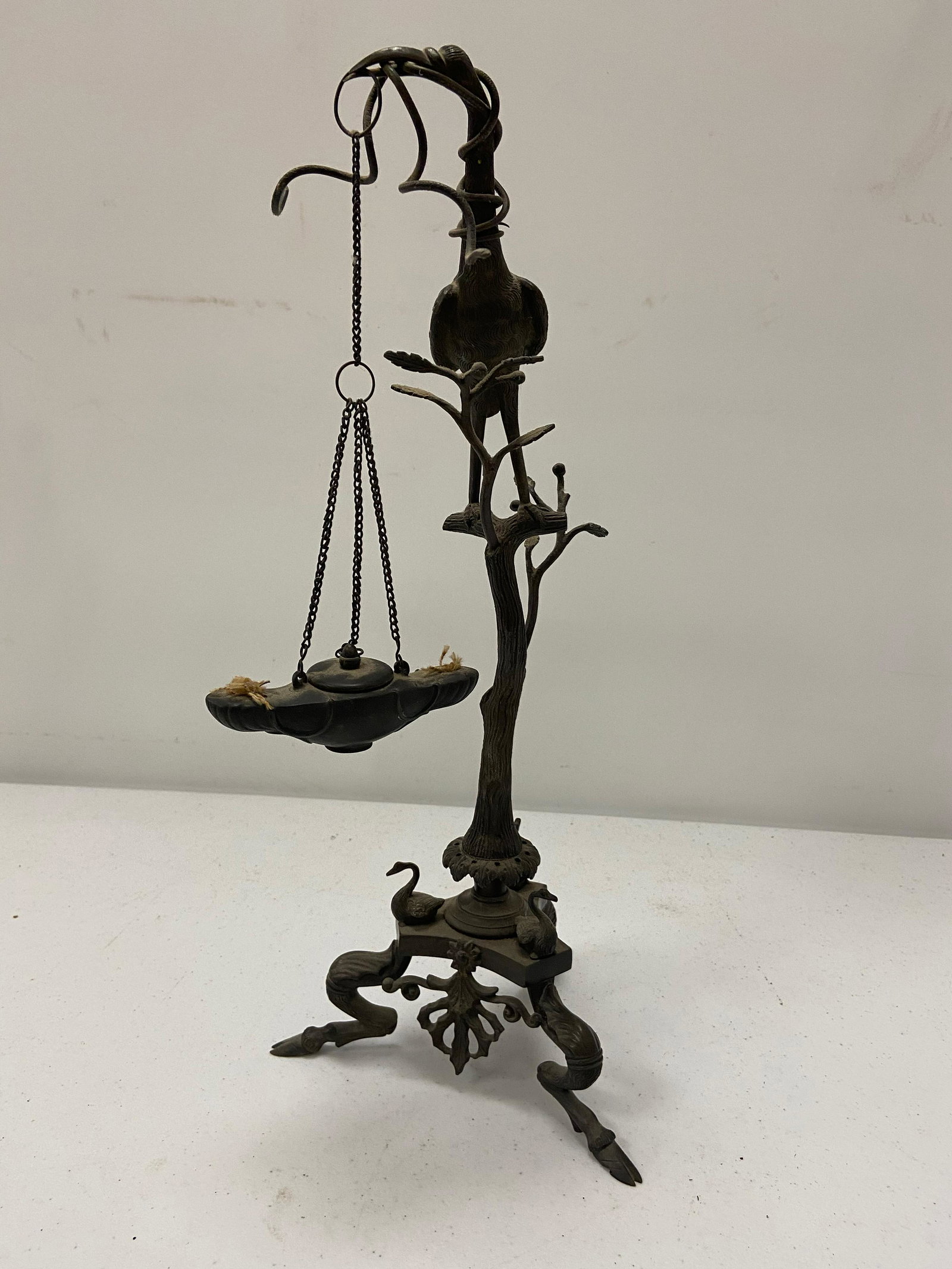 Unusual Early metal Lamp: Unusual Early metal lighting device, Has Heron standing on tree, holding Alladin type font, 3 Geese above Antlerred feet
