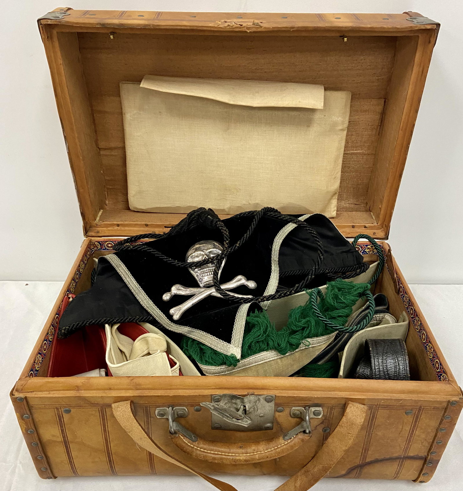 Masonic Knights Templar Trunk & Contents, Sword: Leather Masonic Knights Templar Officers trunk, w/2 Black Aprons, w/2 crossed Swords, & Skeloton, & 1 w/red cross, Black Hat, dried out, Sash, leather belt, w/metal chains, white gloves, arm sleeves, 