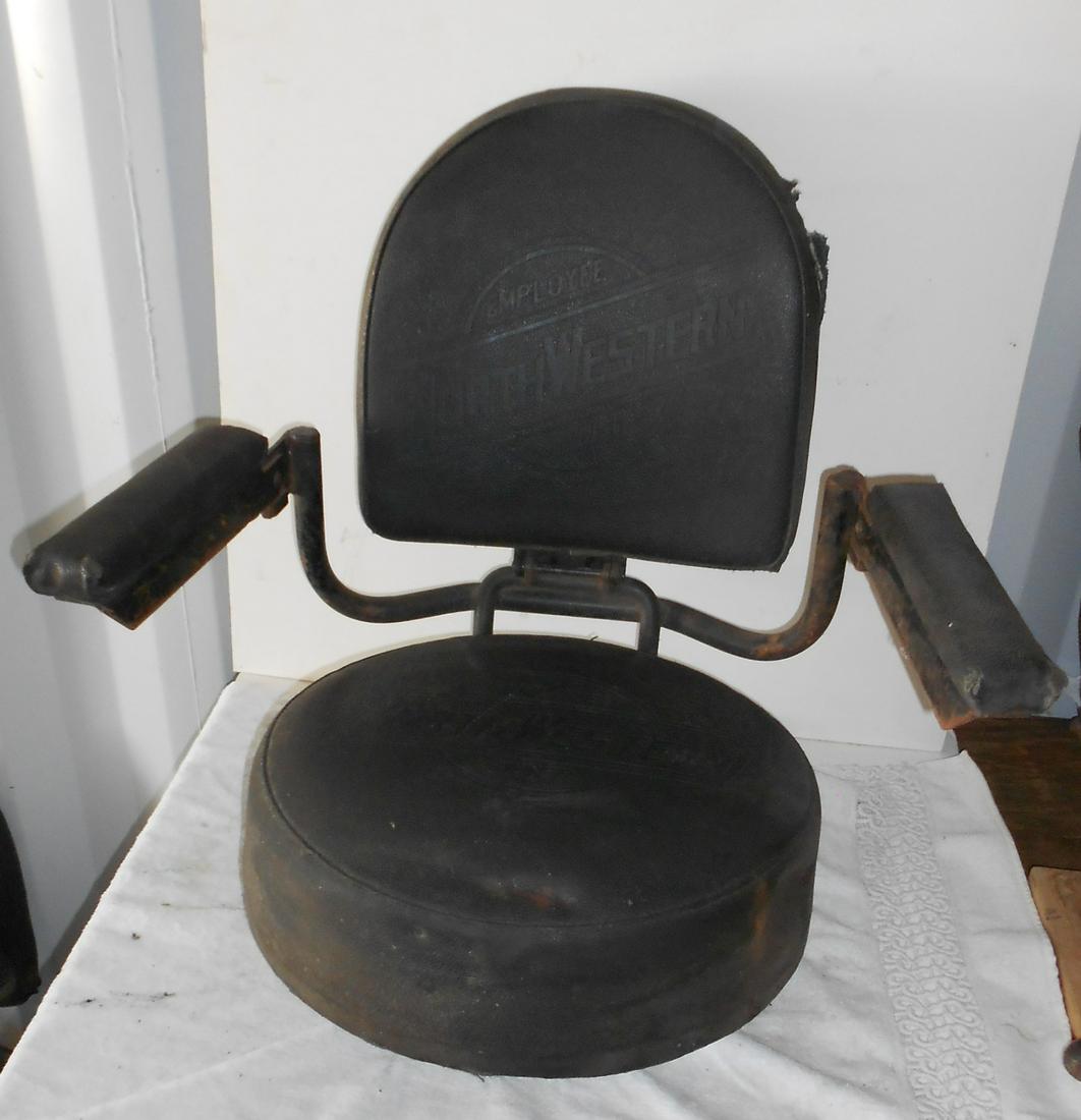 * C&NW Logo Diesel Locomotive "Agreement" Seat: An unusual "agreement" (has arm rests) seat from a Chicago & North Western Railway diesel locomotive. The seat has some standard features like size: 18" diameter and the seat itself without base measu