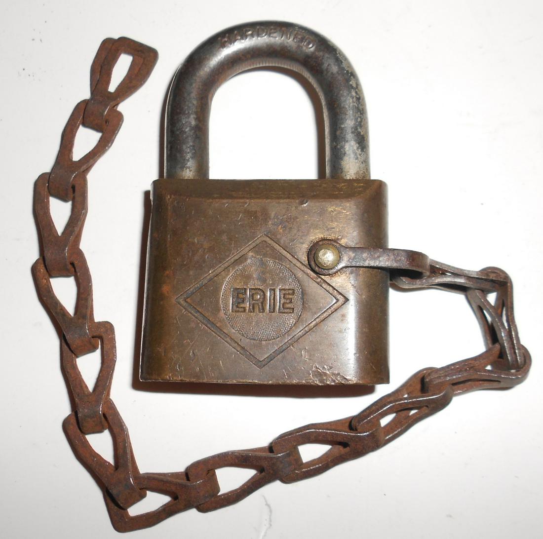 Erie Railroad early Diamond Logo Signal Lock: An unusual signal style lock with an Erie Diamond logo on one side. It has HARDENED on the shackle and some patent info on the top. Odd beveled edges.