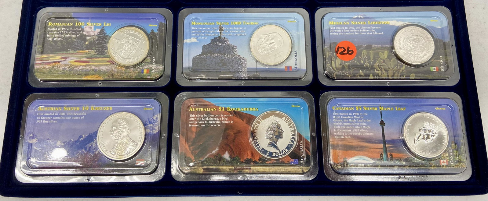 Six Silver Coins: Romanian 100 Silver LEI, Mongolian Silver 1000 Togrog, Mexican Silver Libertad, Austrian Silver 10 Kreuzer, Australian $1 Kookaburra, Canadian $5 Silver Maple Leaf.