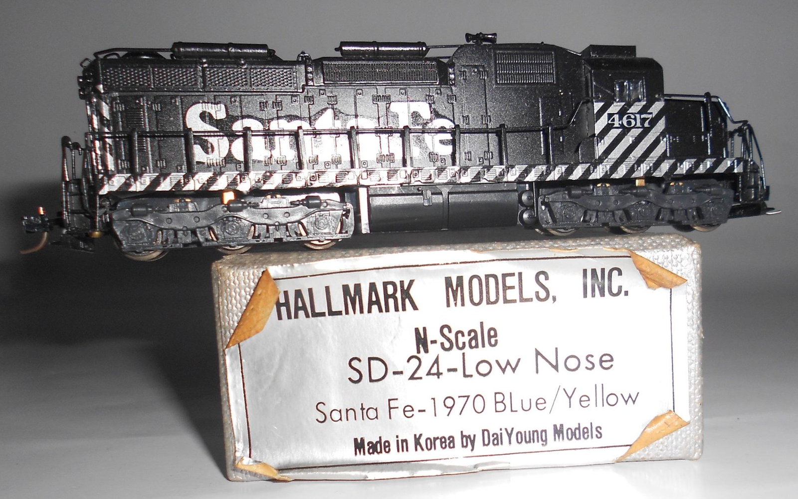 N Scale Brass - Hallmark ATSF SD-24 Custom Paint: N scale brass - Hallmark / Dai Young, Korea - Was a factory painted chop nose Santa Fe SD-24. Originally had 1970's blue and yellow scheme, now has black with decal film that you can see. Somebody did