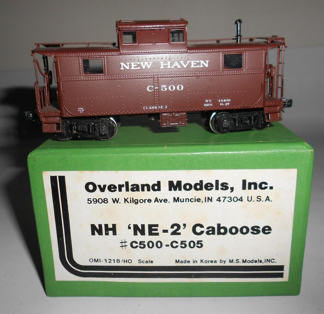 HO Brass - Overland NE-2 Caboose Custom Paint: An interesting and not common NE-2 version caboose make for Overland by MSM in Korea. Decent custom paint as #c-500. Window glazing. Couplers added. This is product OMI 1218/HO. Box and foam are fine.