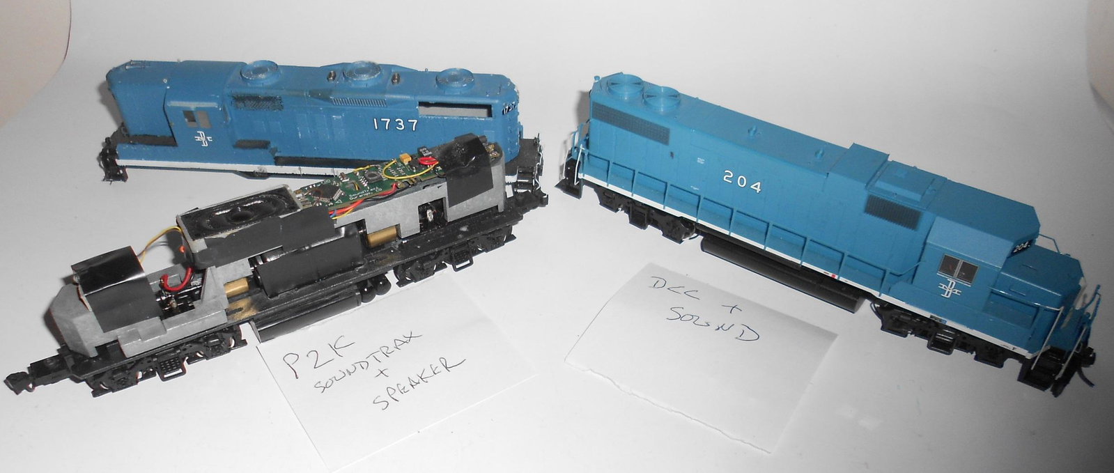 HO Scale - 2 B&M Diesels with DCC & Sound: A pair of loose Boston & Maine diesels with DCC and Sound. (1) GP with cut up body - assuming it's for better sound #1737 (2) Life Like #204 with DCC & Sound, unknown working on DCC and sound on both.