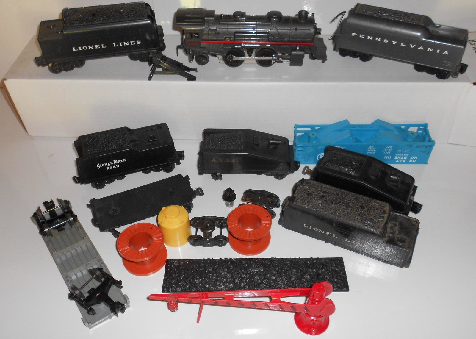 Lionel Orphan O27 Tenders & Parts: There is one 8041 steam locomotive in this group. There are lots of tenders and one tender shell and one tender chassis. Also included is all of the loose parts from the bottom of boxes from this one 