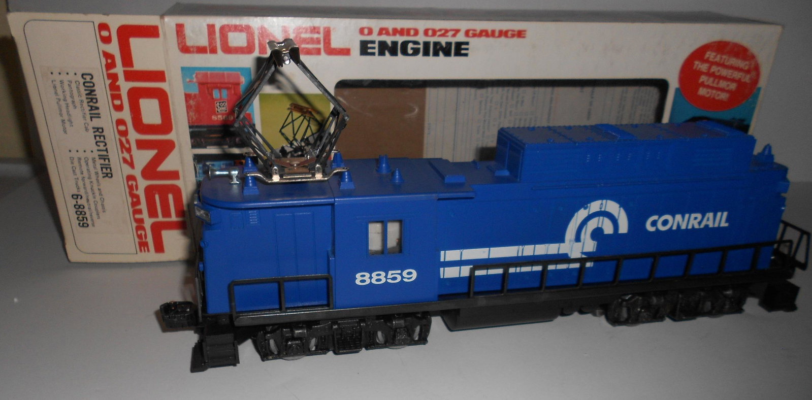Lionel 027 Conrail Rectifier 6-8859: Lionel 027 Rectifier - single pantograph electric (runs 3 rail). 6-8859. It has a headlight and "pallor" motor, traction tires. Light use. Box shows wear and rubbing, Styrofoam has a piece removed to 