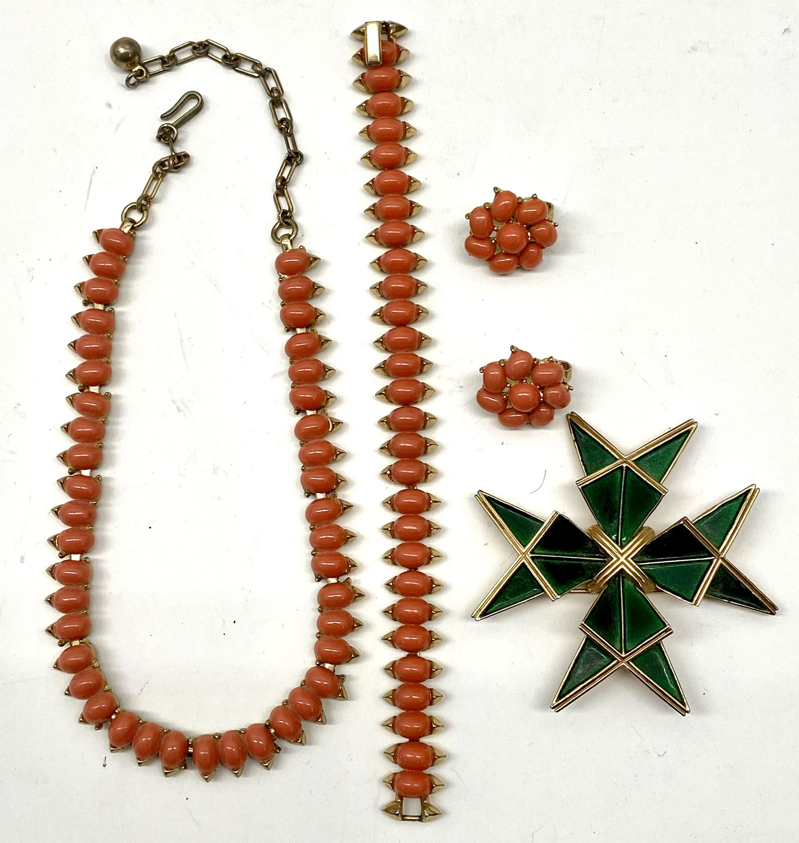 Vintage Costume Jewelry: 3 pc. Trifari set necklace,w/oval Coral, matching bracelet & earrings, Trifari pin, Star shaped in green