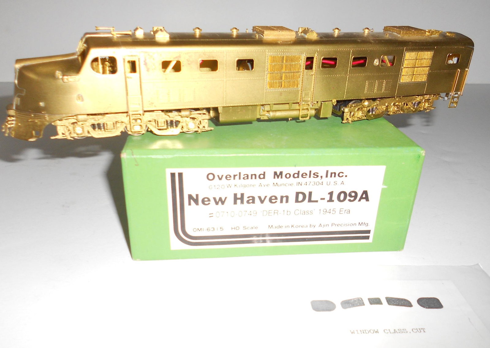 HO Brass - OMI New Haven DL-109A Ajin: HO scale brass locomotive - Made for Overland as their part number 6313 by Ajin. A New Haven Railroad Class DL-109A diesel locomotive. Unpainted and includes the original envelope with window template