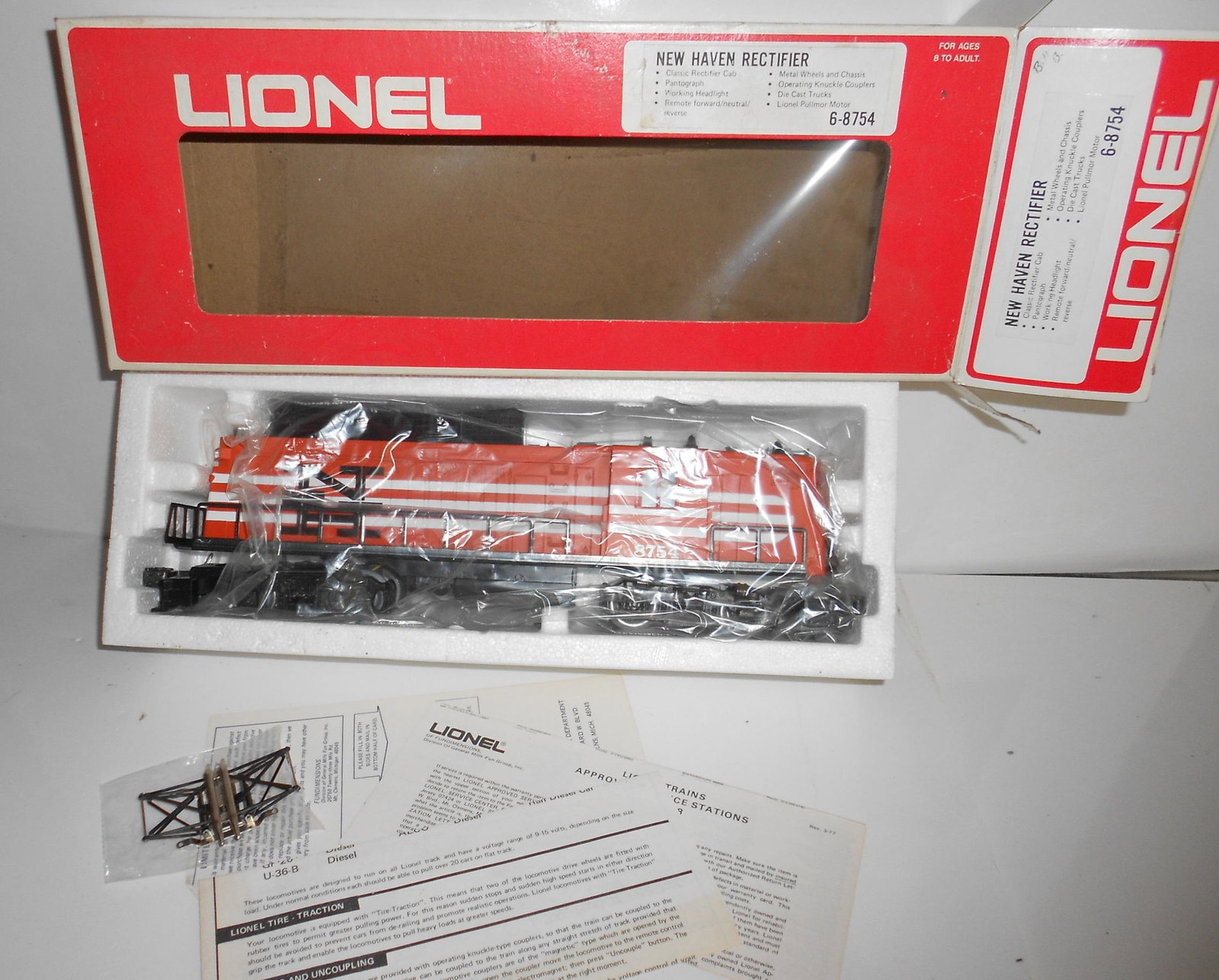 Lionel 6-8754 New Haven Locomotive Rectifier: Lionel electric locomotive - 68754 New Haven electric with pantograph in original plastic baggie. It has paperwork, box shows rubbing.