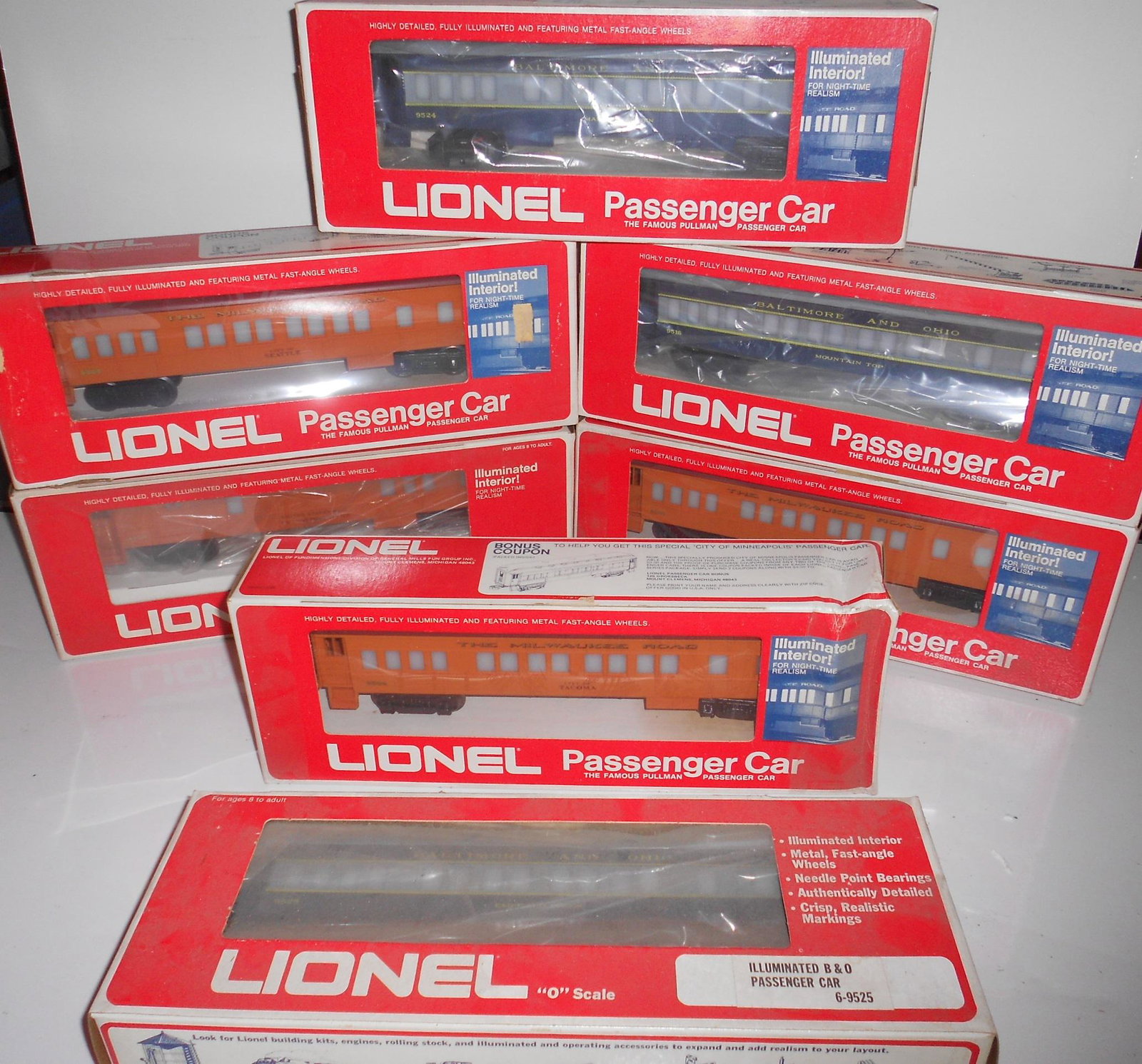 Lionel 7 Passenger Cars Milw., B&O: 7 Lionel passenger cars in boxes. 4 are Milwaukee Road, 3 are Baltimore & Ohio. Some boxes have real wear and rubbing.