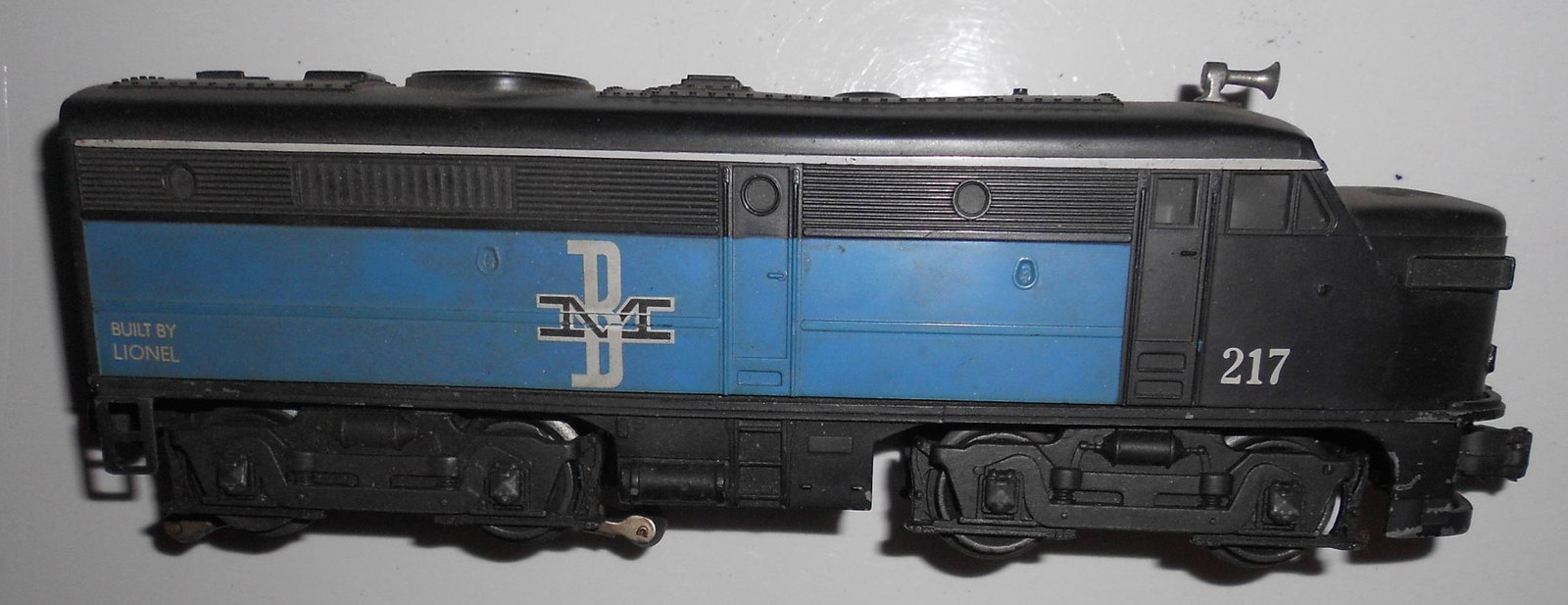 Lionel B&M 217 Diesel Locomotive: Lionel 217 for the Boston & Maine Railroad. No box. Some layout use.