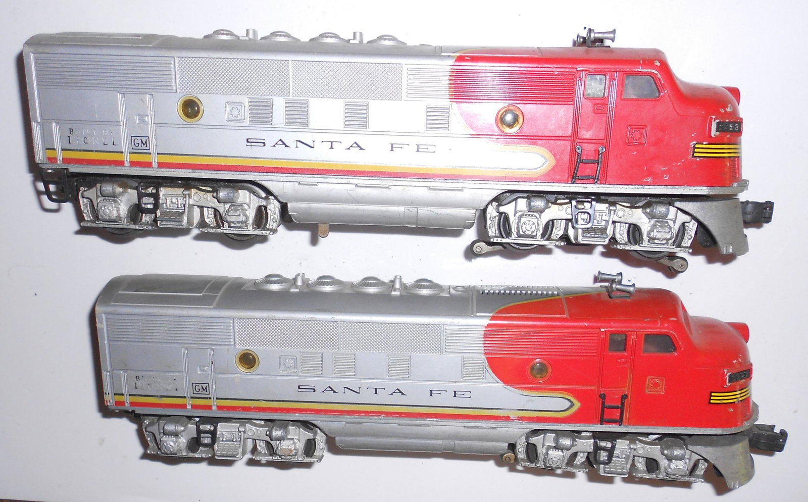 Lionel 2353 Santa Fe Warbonnet (2) Diesels: Lionel a pair of 2353 diesels in Santa Fe Warbonnet scheme. Both show real layout use.