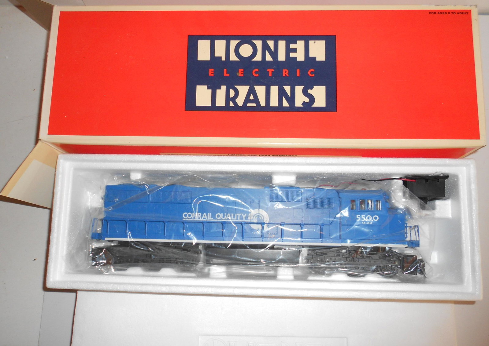 Lionel Conrail SD-60M Locomotive 6-18216: Lionel 6-34606 Conrail SD-60M diesel locomotive as Conrail #5500. It has Conrail Quality advertising. Inner Styrofoam is fine, box has minor rubbing.