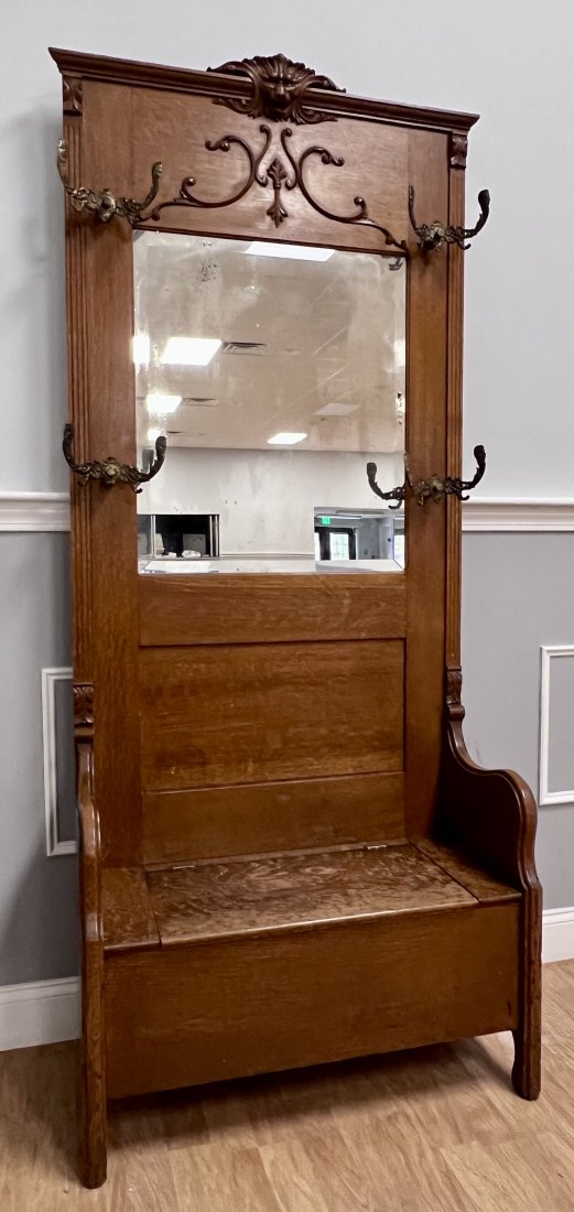 Oak Hall Seat: Nice Quarted Oak Hall seat. Carved lion face on top. Nice original hooks.See photos as they are part of the description.Coming from a local Estate.