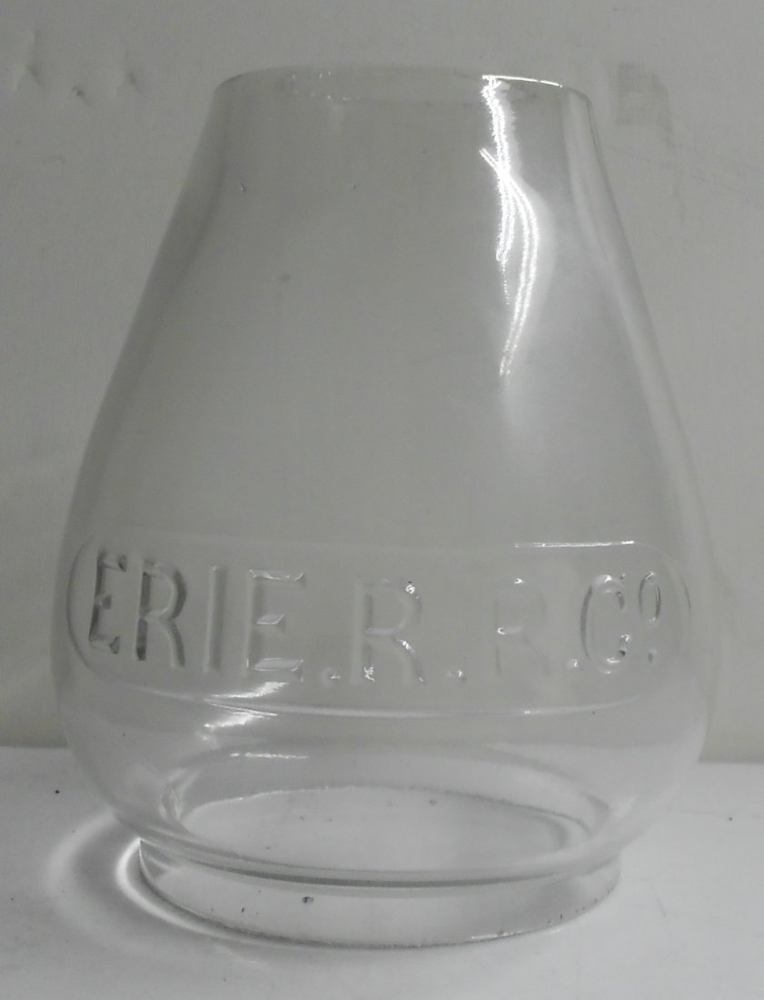 Erie Railroad Company Extended Base cast Globe - round ends: This type of extended base globe was used by just a few rrailroads. They have 1/2 round ends and strong cast lettering. They are also more bulbous than a stanard #39. This one has ERIE.R.R. Co. in a p