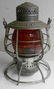 Union Pacific Railroad "Adams" Lantern Red Cast Logo Globe: An Adams & Westlake "Adams" model lantern with UNION PACIFIC spelled out on the lid. This model has flat verticals, 3 internal leaf springs to hold the pot in place and Adams & Westlake information on
