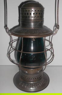 Fitchburg Railroad Steam Gauge Triple Marked Lantern Green Cast Globe: Triple marked Fitchburg tin top, bellbottom lantern. A single piece double marked frame by Steam Gauge made for the Fitchburg Railroad. The concentric rings on the top are the give-away that it's a St