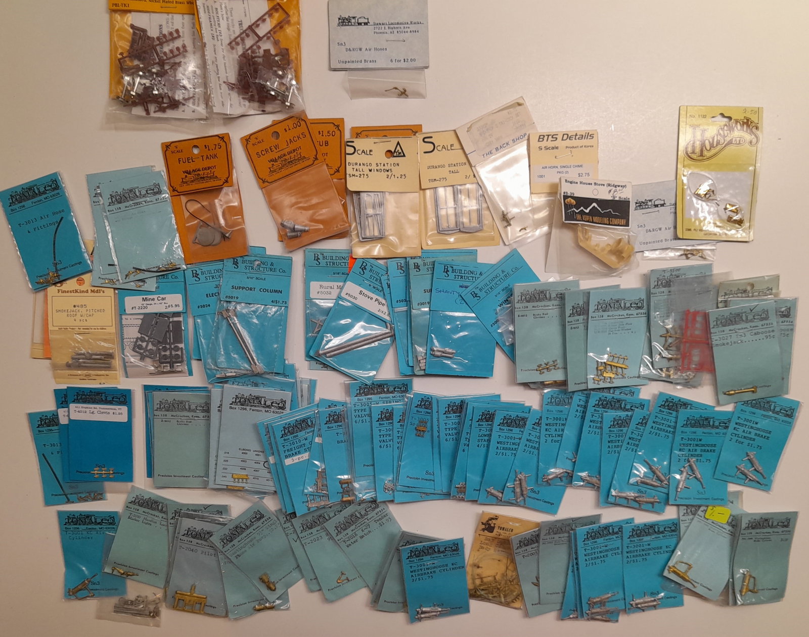 S Scale Detail Parts (120) Tomalco & others: S scale mostly narrow gauge Sn3 detail parts and castings, I counted about 120 packages. Lots of brass details with several duplicates. Building Structures Co has a few packages.